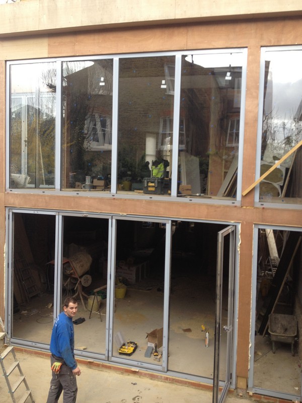 Aluminium bi-fold doors with two-storey glazing in Potters Bar